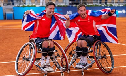 Gordon Reid and Alfie Hewett on court, wearing union jacks