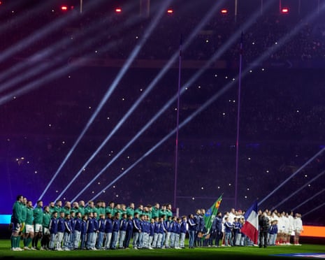 The France and Ireland players line up before the Six Nations opener at the Stade de France.