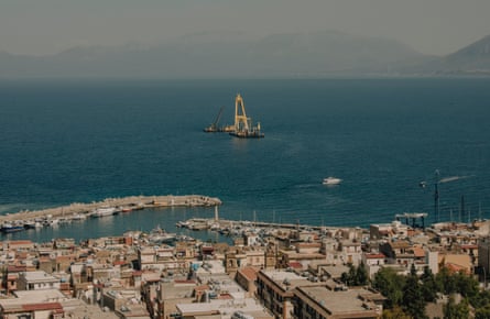 The village of Porticello from above, with a floating crane on the sea