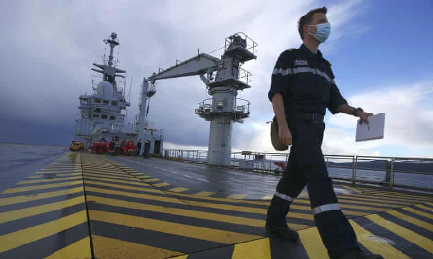 A naval officer on the deck of the French helicopter carrier Tonnerre