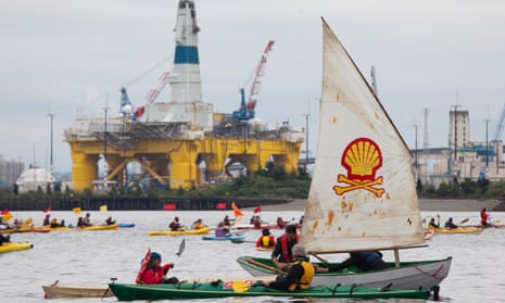 Protesters in kayaks demonstrate against Shell’s Arctic oil plans in Seattle bay