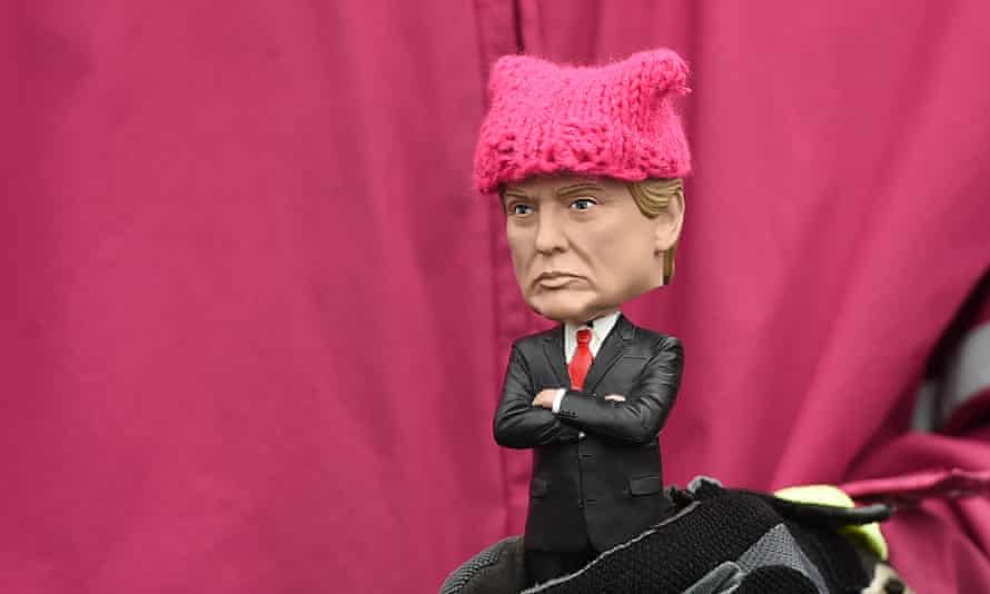 A protester holds a little Donald Trump doll during the Women’s March on January 21, 2017