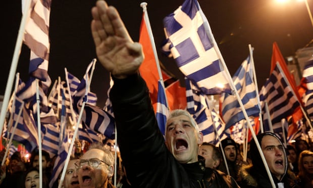 A supporter of Greece’s far-right party Golden Dawn raises his hand in a Nazi-style salute during a rally in Athens in 2014.