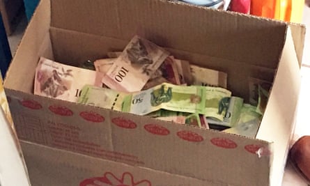 Notes dumped in a box in a border supermarket.