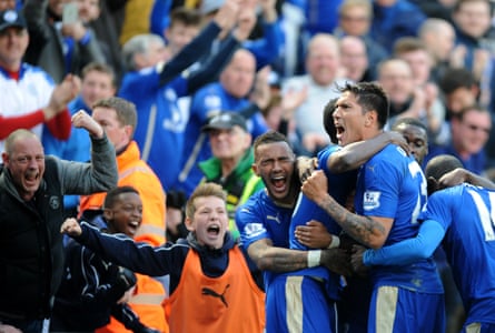 Danny Simpson celebrates with teammates after Leonardo Ulloa scores