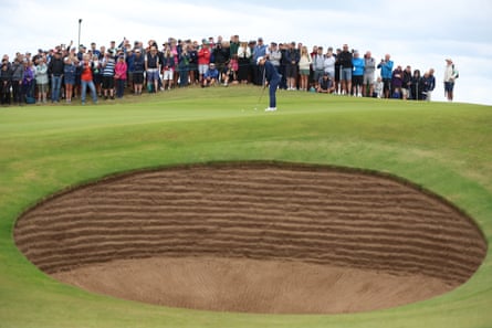 Spectators watch England’s Lottie Woad hole a birdie putt on the 10th on day two of the 2025 Women’s Open at Royal Porthcawl.