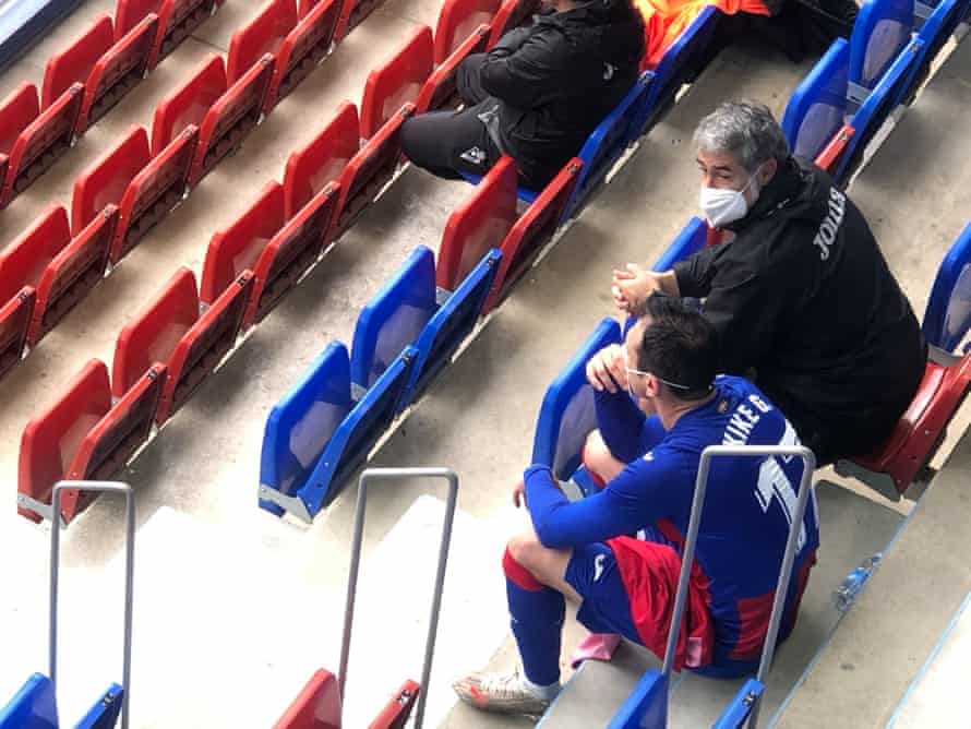 Eibar’s Kike García sits in the stands to watch the final few minutes of his team’s win over Alaves with goalkeeper coach Josu Anuzita