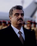 A portrait of Rafik Hariri in a dark suit