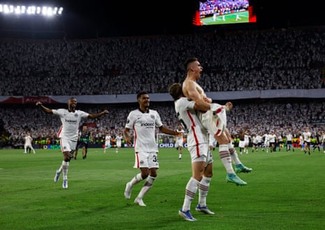 Eintracht Frankfurt’s Rafael Santos Borre celebrates with Christopher Lenz and teammates after scoring the winning penalty during the shoot-out to win the Europa League.