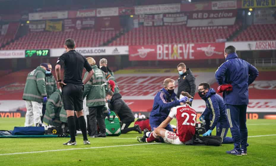 Wolves’ Raúl Jiménez and Arsenal’s David Luiz receive medical attention after a head-on collision