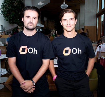 Nic Young and Felix Henderson wearing their company logo T-shirts.