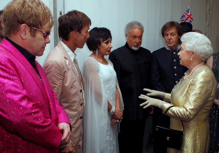 Queen Elizabeth meets singers Elton John, Cliff Richard, Shirley Bassey, Tom Jones and Paul McCartney backstage at the Diamond Jubilee concert at Buckingham Palace in June 2012.