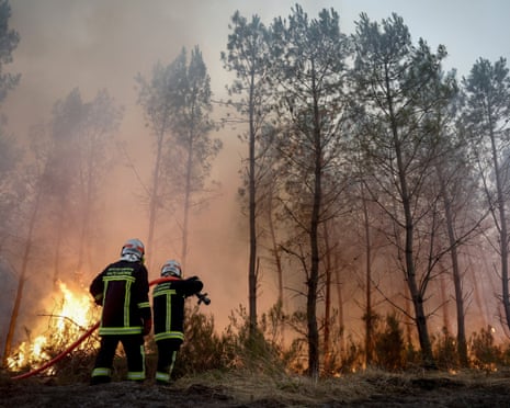 Firefighters battle a forest fire in Saint-Jean-d'Illac, some 30km from Bordeaux, France.