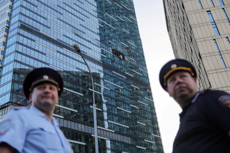 Emergency personnel work near a damaged office building in Moscow.