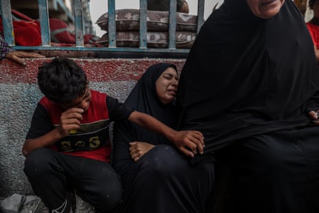 Distressed Palestinians mourn after Israel’s military hit the Unrwa school sheltering thousands of people in Nuseirat refugee camp, 6 June.