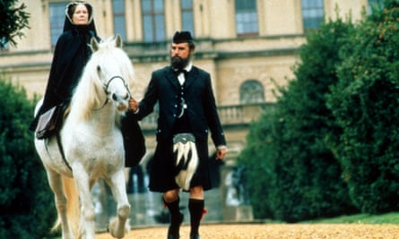 Judi Dench on horseback with Billy Connolly holding the reins in a scene from Mrs Brown