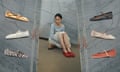 A model wearing red crochet ballet pumps against a marble backdrop.