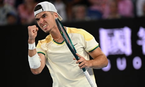Dino Prizmic reacts against Novak Djokovic during their men's singles match on day one of the Australian Open in Melbourne
