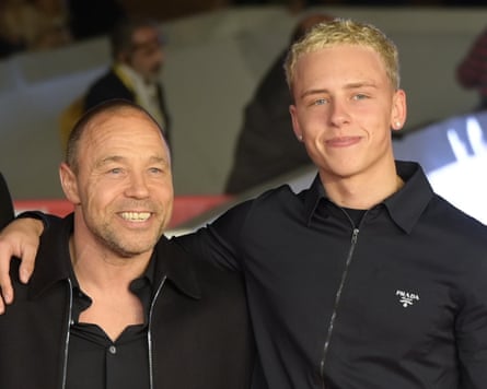 Stephen Graham and sons, both in black, stand with their arms around each other at a red-carpet event in 2025