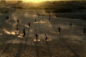 Footballers in the sand
