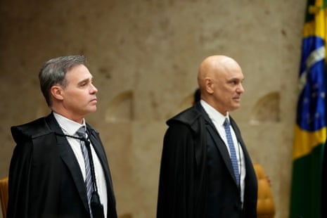 Two men in black suits.