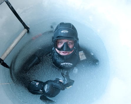 Allan in diving gear in ice hole