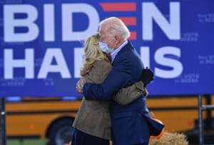 Joe Biden and his wife Jill Biden hug on stage during a drive-In rally in Dallas, Pennsylvania, last week.