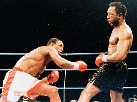 Nigel Benn dodges a Chris Eubank punch.