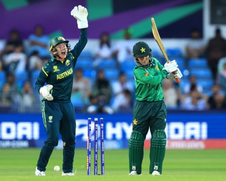 Pakistan's Nashra Sandhu is bowled out by Australia's Sophie Molineux.