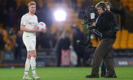 Kevin De Bruyne of Manchester City is filmed by a TV camera after scoring a hat-trick at Wolves in May 2022