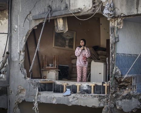 A Lebanese girl is seen inside her house, which was heavily damaged in an attack carried out by the Israeli army in Sidon, Lebanon, on 30 October 2024