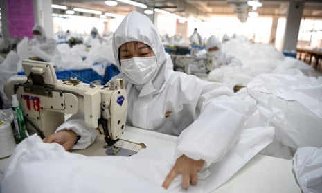 Workers in Wenshou sew hazardous material suits to be used in the Covid-19 coronavirus outbreak.