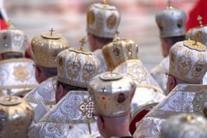 Bishops wearing ornate headgear attend a eucharistic celebration at the Vatican