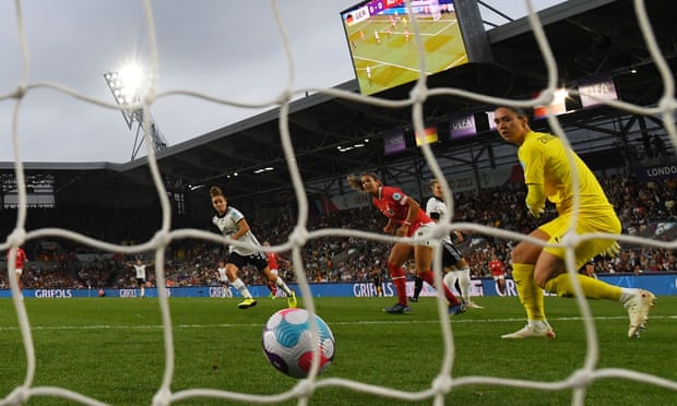 Lina Magull watches her strike beat the Austria goalkeeper to give Germany the lead.