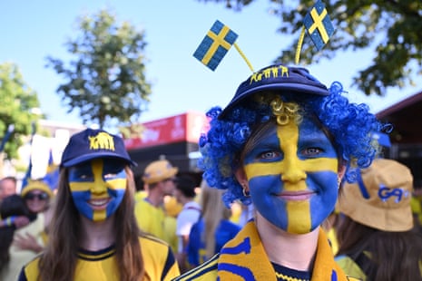 Swedish supporters’ group the Soft Hooligans cheer for their team ahead of the game.