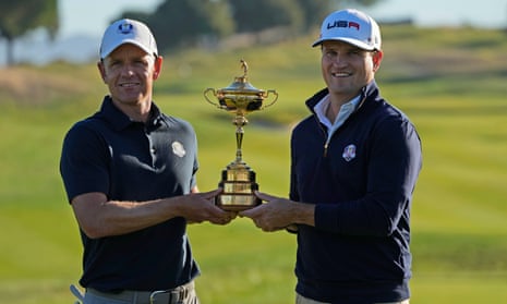Luke Donald and the United States captain, Zach Johnson, pose with the Ryder Cup trophy