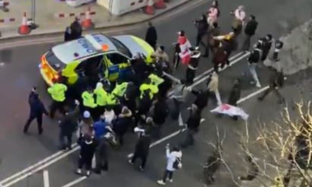 Officers used a police vehicle to escort Keir Starmer to safety after the Labour leader was surrounded by protesters on Monday.