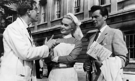 Michael Medwin, left, with Shirley Eaton and Dirk Bogarde in Doctor at Large, 1957.