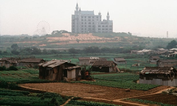 A Disney-like theme park emerges from the green fields surrounding Shenzhen in 1992.