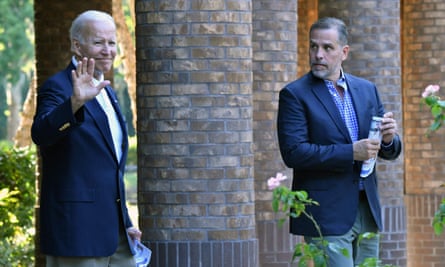 Joe Biden salutes alongside his son Hunter after attending mass at Holy Spirit Catholic Church in Johns Island, South Carolina on August 13, 2022.