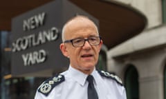 Rowley in front of Scotland Yard sign