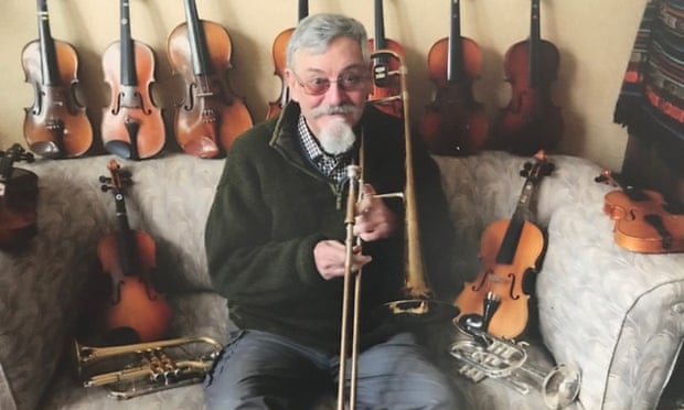 Michael Gerard at home with some of his many musical instruments