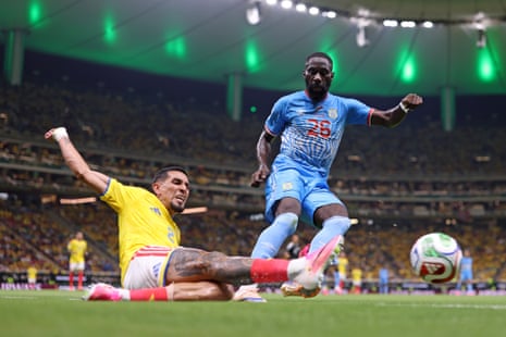 Daniel Munoz competes for the ball against Arthur Masuaku