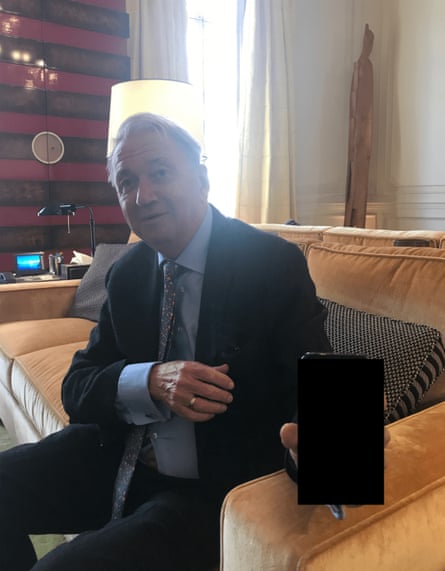 Terje Rød-Larsen holding a mobile phone