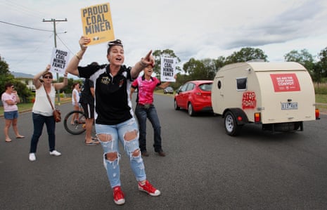 Pro-coal locals show their opposition to last year’s anti-Adani convoy as it arrives in Clermont