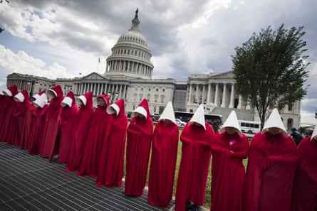 Supporters of Planned Parenthood dress in costumes from the dystopian novel The Handmaid’s Tale to protest against the Senate Republican’s health care bill outside the US Capitol in Washington, DC, USA, 27 June 2017