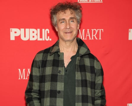 Man in front of film board