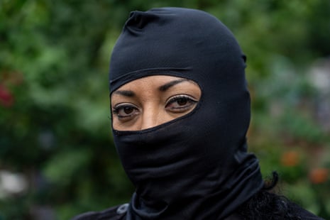 Marta, 52, a police officer in Chapeltique, wears a balaclava for fear of gang reprisals.