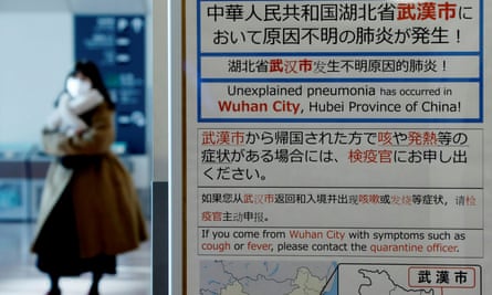 A quarantine notice about the outbreak of the coronavirus in Wuhan at an arrivals hall at Haneda airport in Tokyo, Japan.
