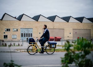 A postman rides his bike outside the Sundbyberg facility.